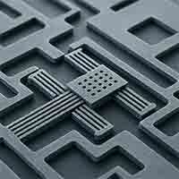 microelectromechanical system (MEMS) device fabricated from thick silicon wafer with clearly visible etched microchannels.