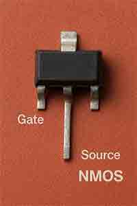 NMOS transistor with visible leads labeled Gate, Source, and Drain