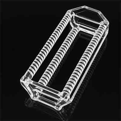 clear quartz boat used in semiconductor processing, shown on a reflective black surface